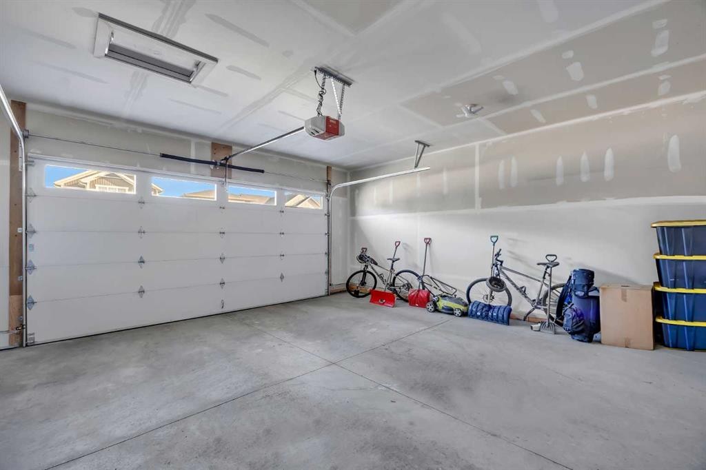 13 Emerson Crescent, Okotoks, AB - Indoor Photo Showing Garage
