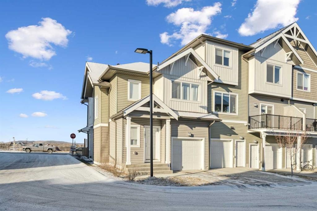 101-24 Rivercrest Drive, Cochrane, AB - Outdoor With Facade