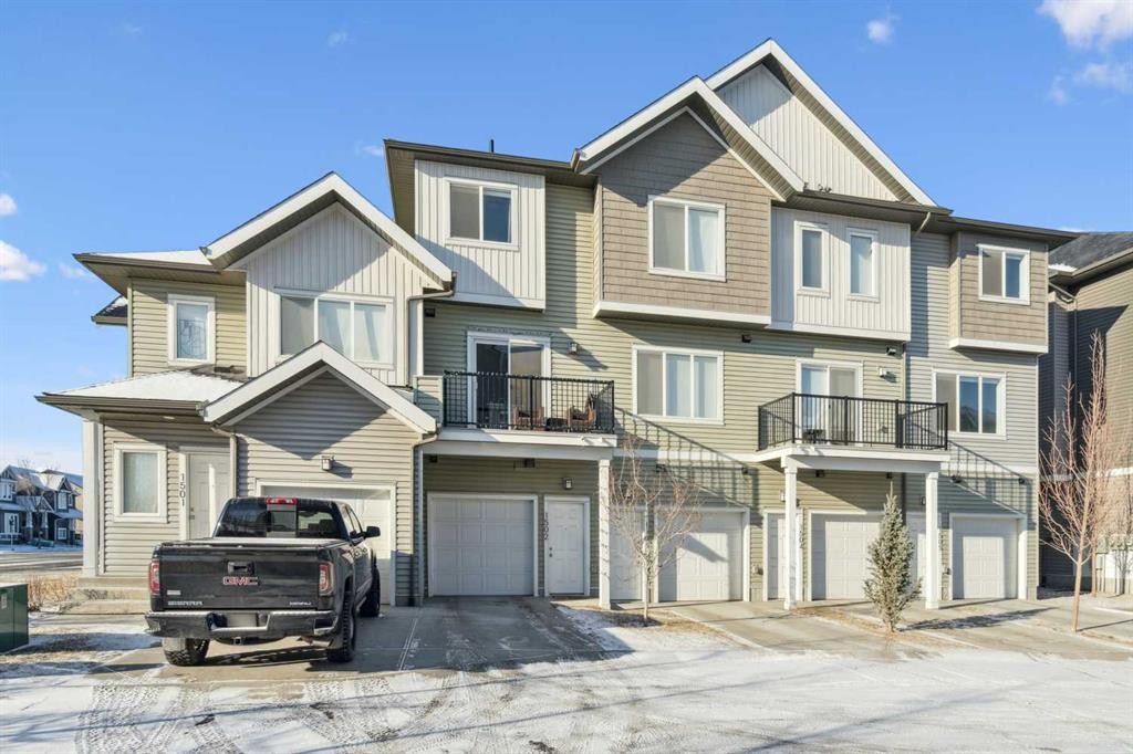 1502-24 Rivercrest Drive, Cochrane, AB - Outdoor With Facade