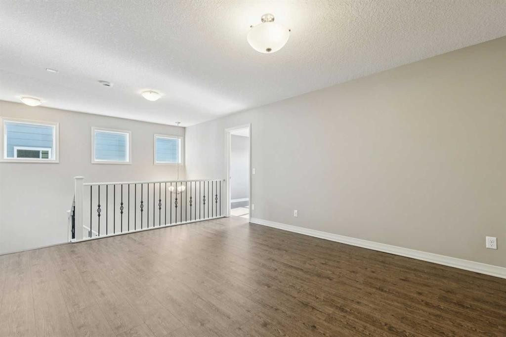 33 Sundown Grove, Cochrane, AB - Indoor Photo Showing Other Room