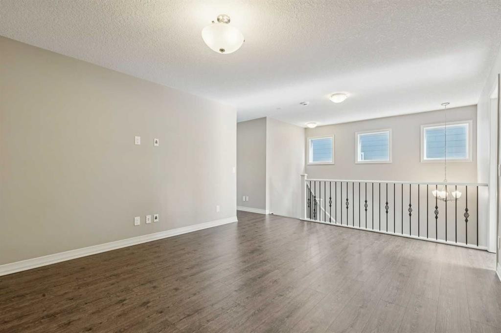 33 Sundown Grove, Cochrane, AB - Indoor Photo Showing Other Room