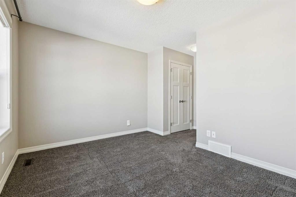 33 Sundown Grove, Cochrane, AB - Indoor Photo Showing Other Room
