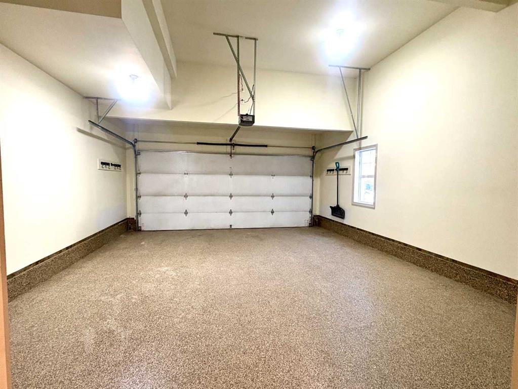 33 Sundown Grove, Cochrane, AB - Indoor Photo Showing Garage