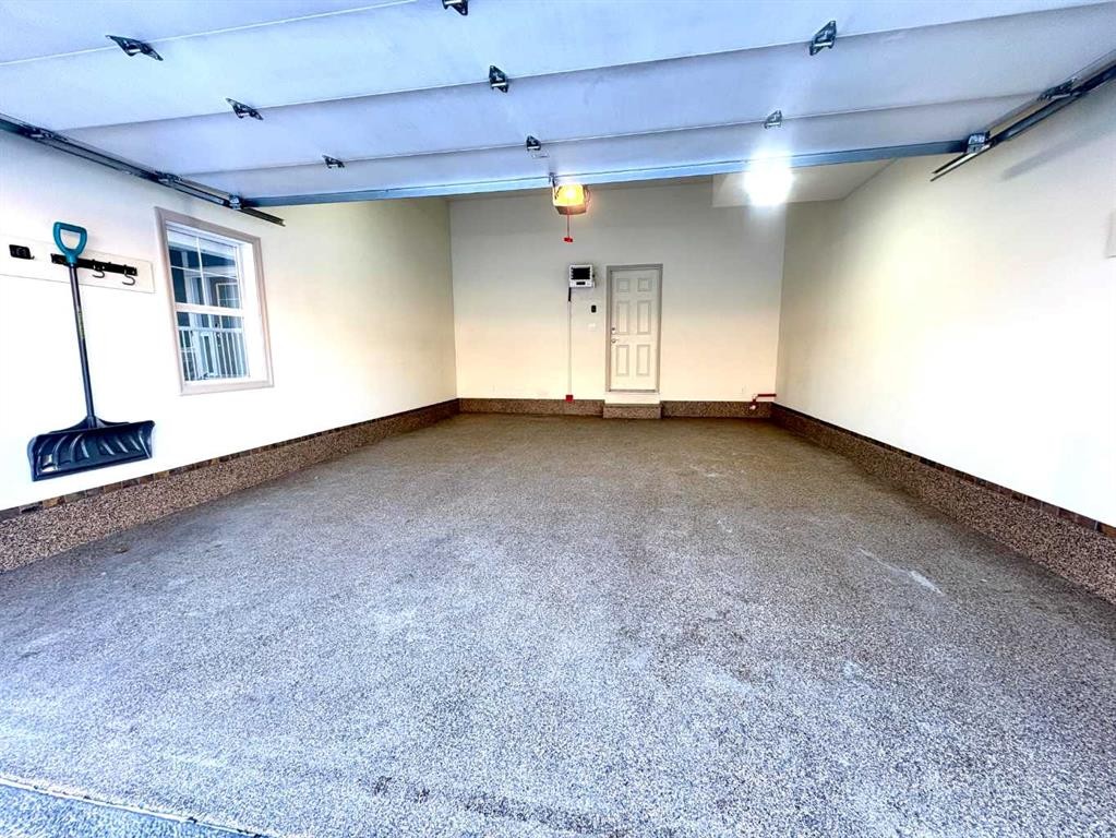 33 Sundown Grove, Cochrane, AB - Indoor Photo Showing Garage