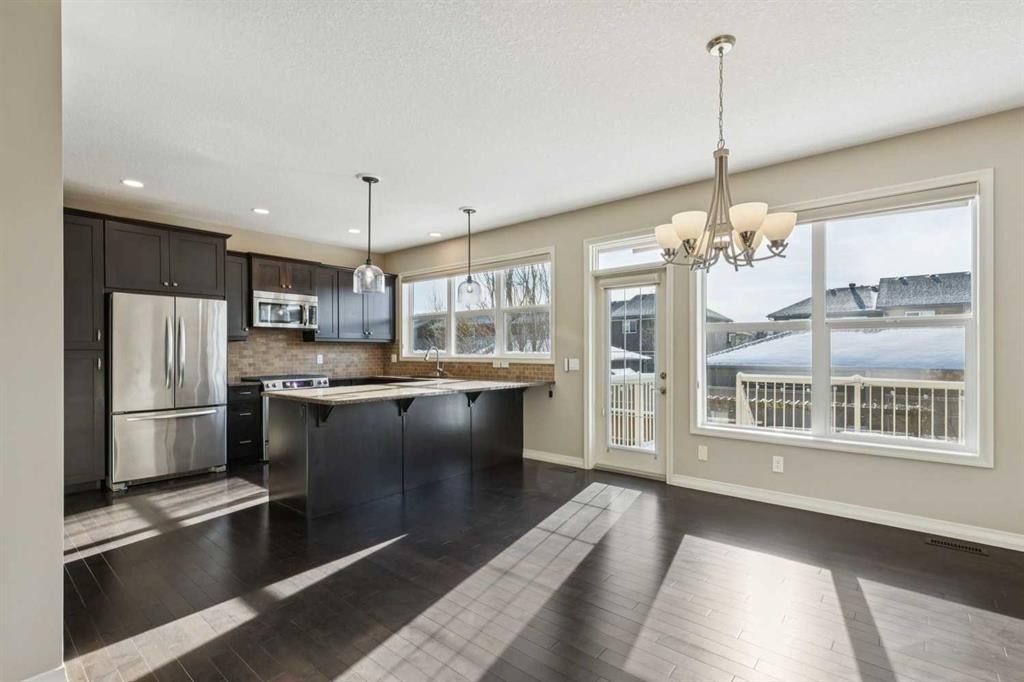 33 Sundown Grove, Cochrane, AB - Indoor Photo Showing Kitchen With Upgraded Kitchen