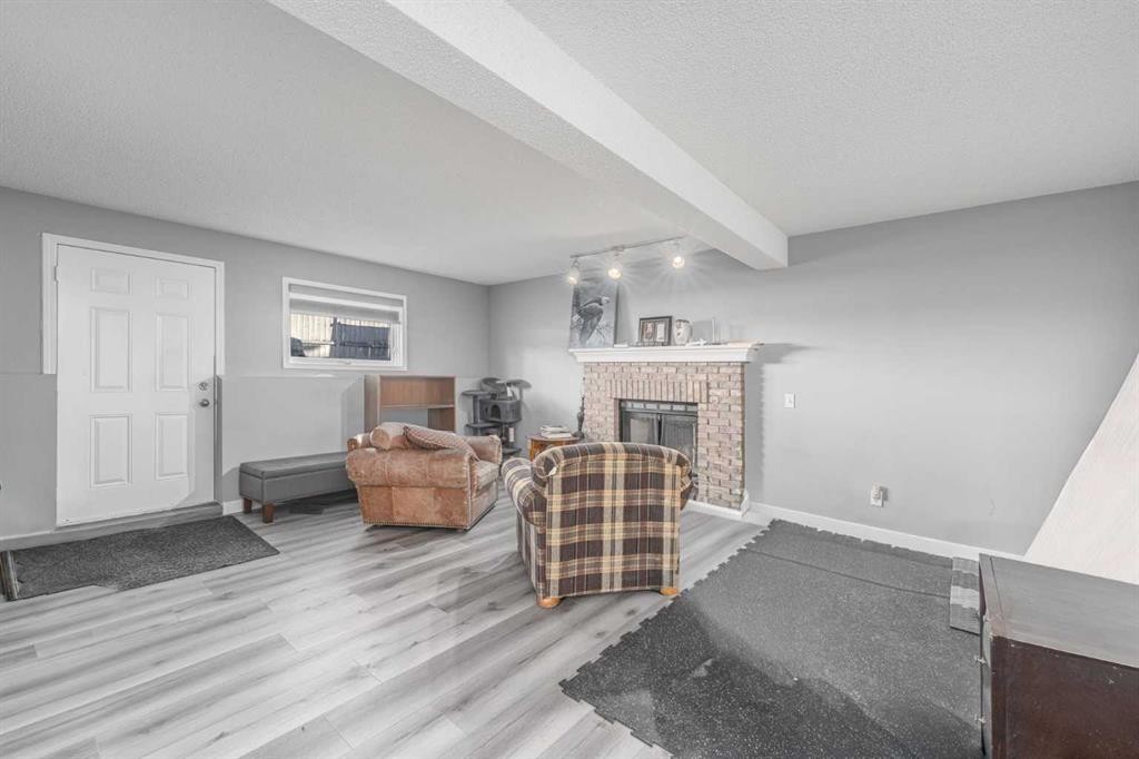 14 Coral Sands Place Ne, Calgary, AB - Indoor Photo Showing Living Room With Fireplace