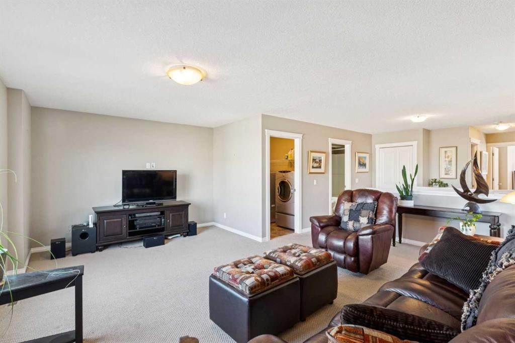 645 Panatella Boulevard Nw, Calgary, AB - Indoor Photo Showing Living Room