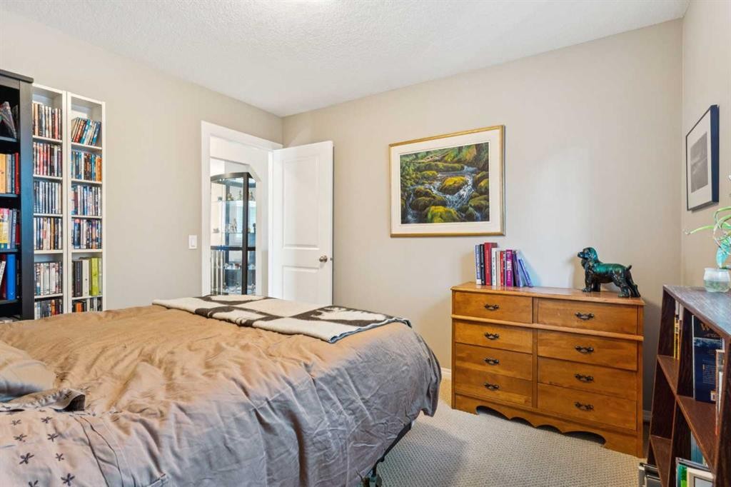 645 Panatella Boulevard Nw, Calgary, AB - Indoor Photo Showing Bedroom