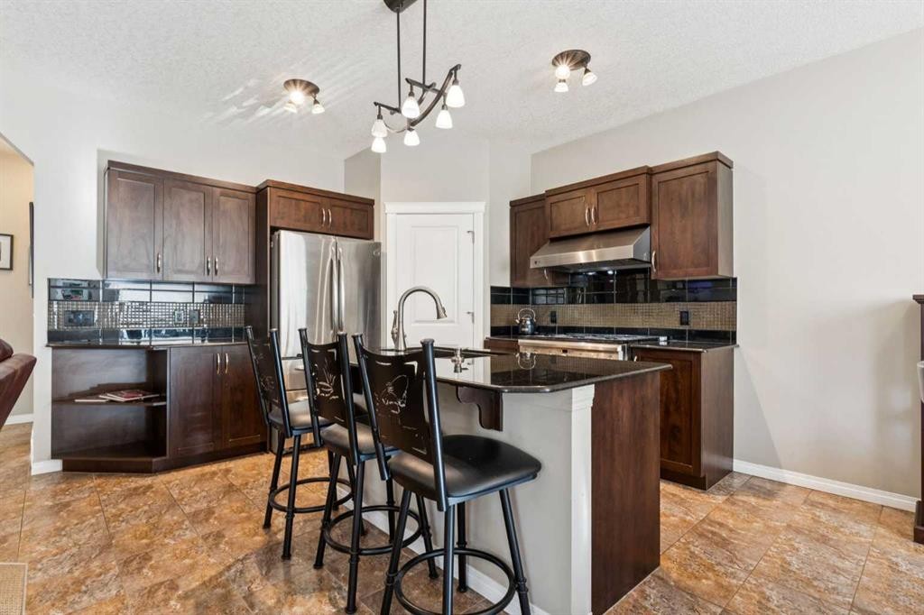645 Panatella Boulevard Nw, Calgary, AB - Indoor Photo Showing Kitchen With Stainless Steel Kitchen