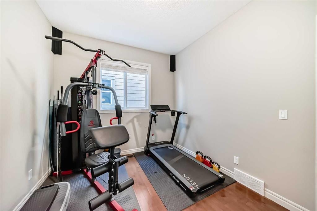 57 Silverado Skies Way Sw, Calgary, AB - Indoor Photo Showing Gym Room