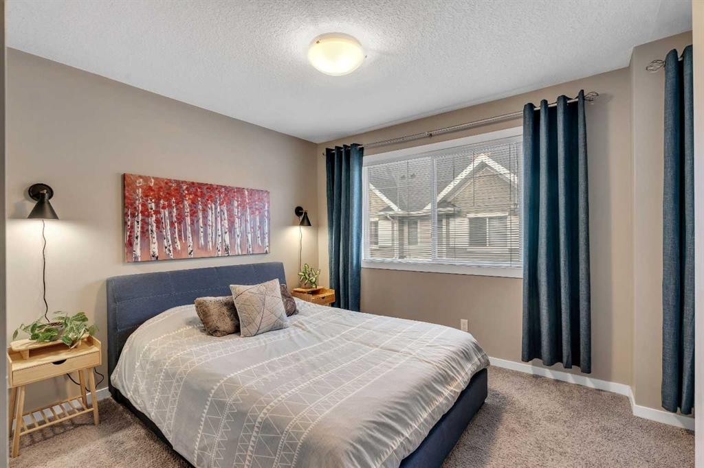 221 New Brighton Row Se, Calgary, AB - Indoor Photo Showing Bedroom