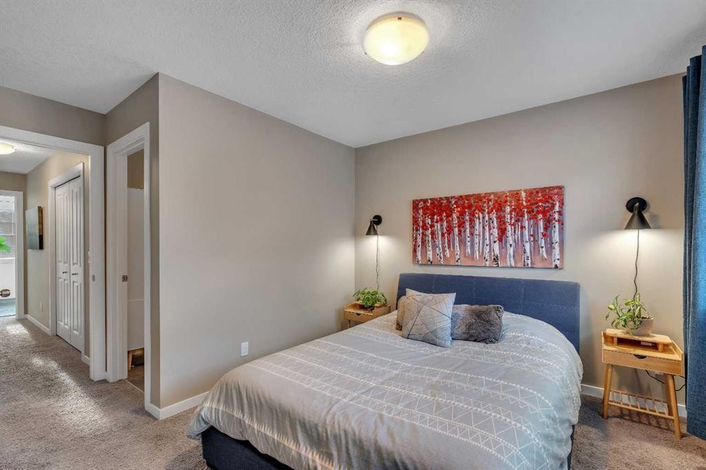 221 New Brighton Row Se, Calgary, AB - Indoor Photo Showing Bedroom