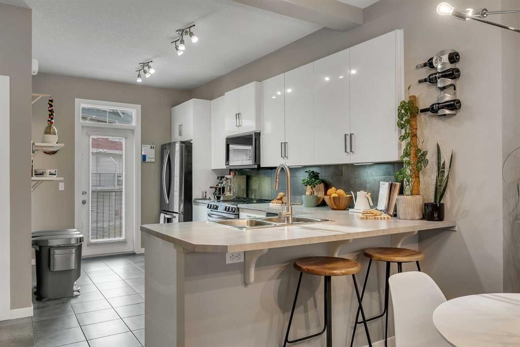 221 New Brighton Row Se, Calgary, AB - Indoor Photo Showing Kitchen With Double Sink With Upgraded Kitchen