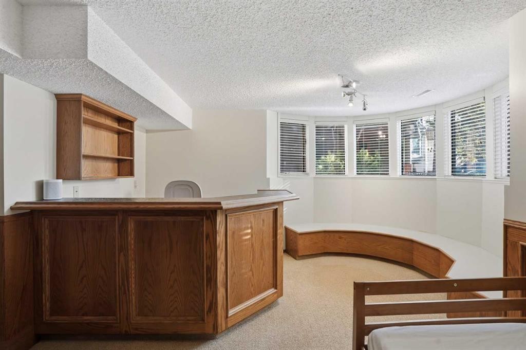 311 Coach Light Bay Sw, Calgary, AB - Indoor Photo Showing Other Room