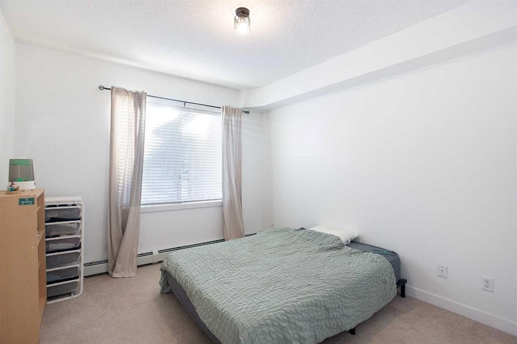 1116-211 Aspen Stone Boulevard Sw, Calgary, AB - Indoor Photo Showing Bedroom