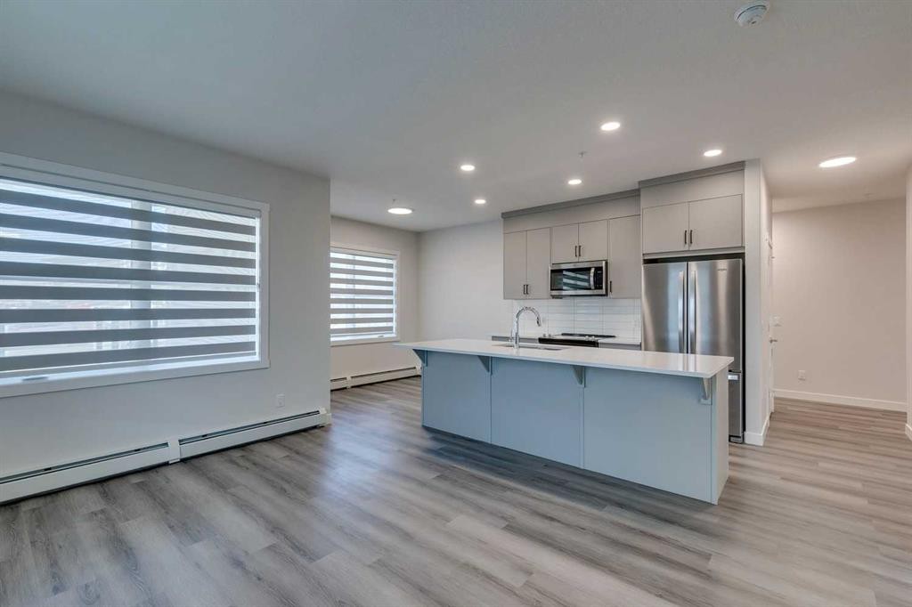 113-55 Wolf Hollow Crescent Se, Calgary, AB - Indoor Photo Showing Kitchen With Stainless Steel Kitchen With Upgraded Kitchen