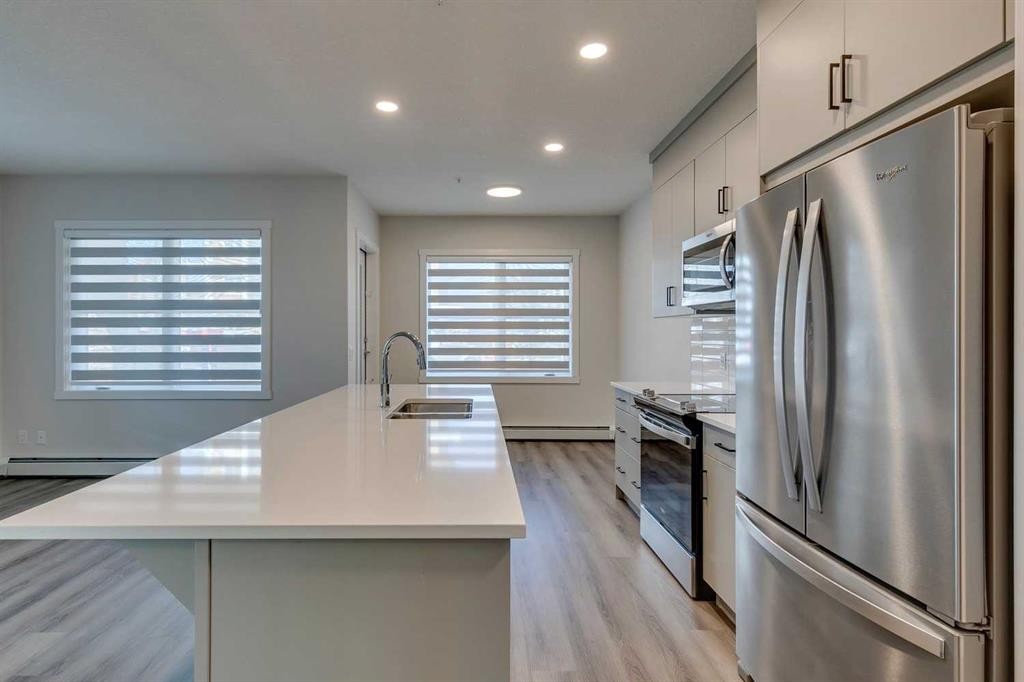 113-55 Wolf Hollow Crescent Se, Calgary, AB - Indoor Photo Showing Kitchen With Stainless Steel Kitchen With Double Sink With Upgraded Kitchen