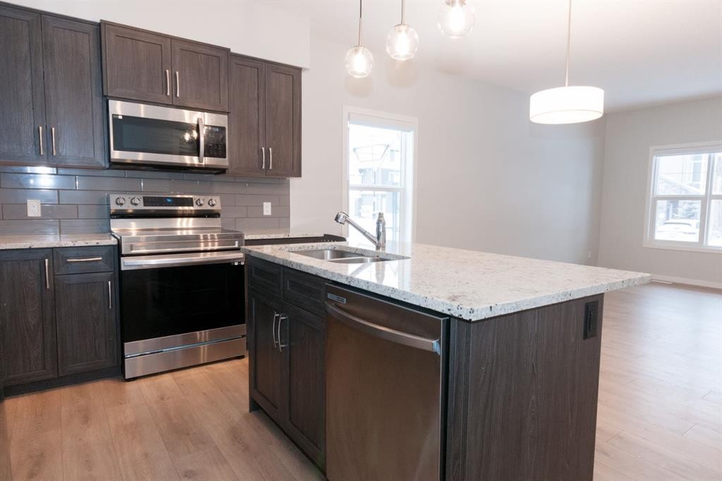 401-250 Fireside View, Cochrane, AB - Indoor Photo Showing Kitchen With Double Sink