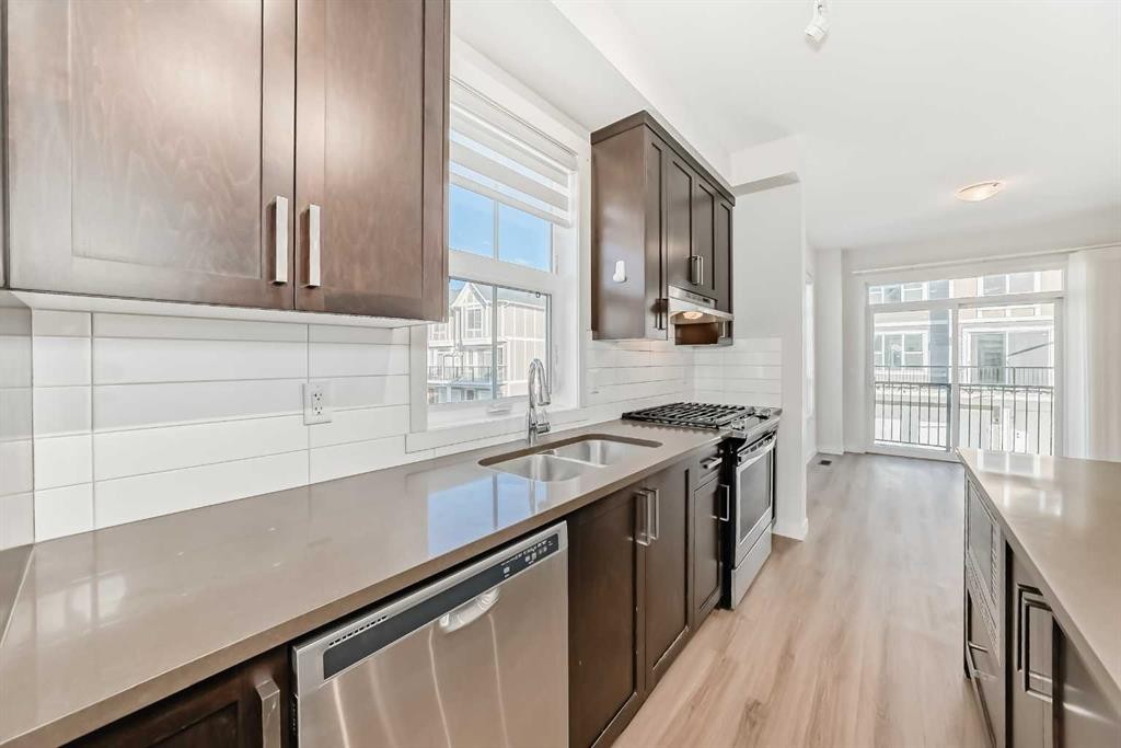 986 Sherwood Boulevard Nw, Calgary, AB - Indoor Photo Showing Kitchen With Stainless Steel Kitchen With Double Sink With Upgraded Kitchen