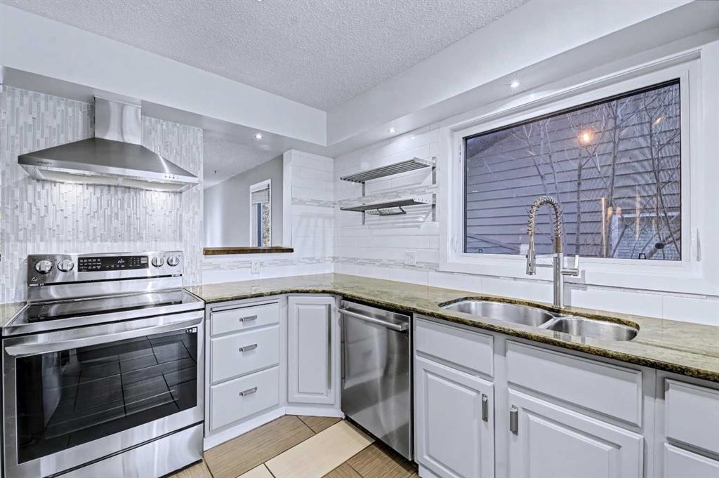 188 Bernard Drive Nw, Calgary, AB - Indoor Photo Showing Kitchen With Double Sink