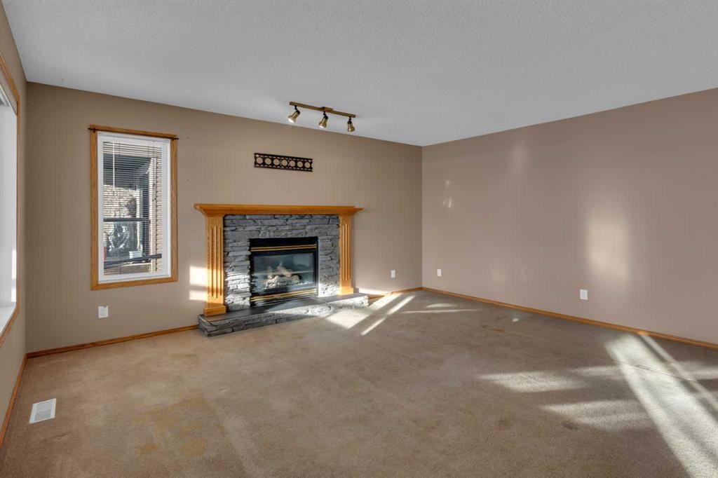 111 Hillview Road, Strathmore, AB - Indoor Photo Showing Living Room With Fireplace