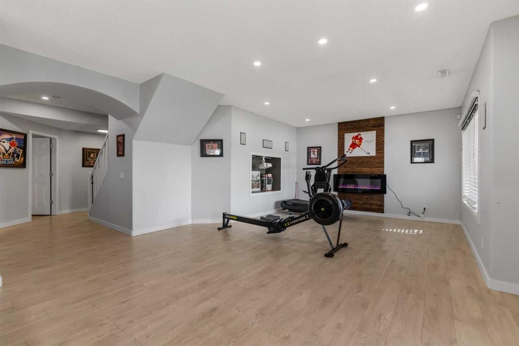 328 Rainbow Falls Way, Chestermere, AB - Indoor Photo Showing Gym Room