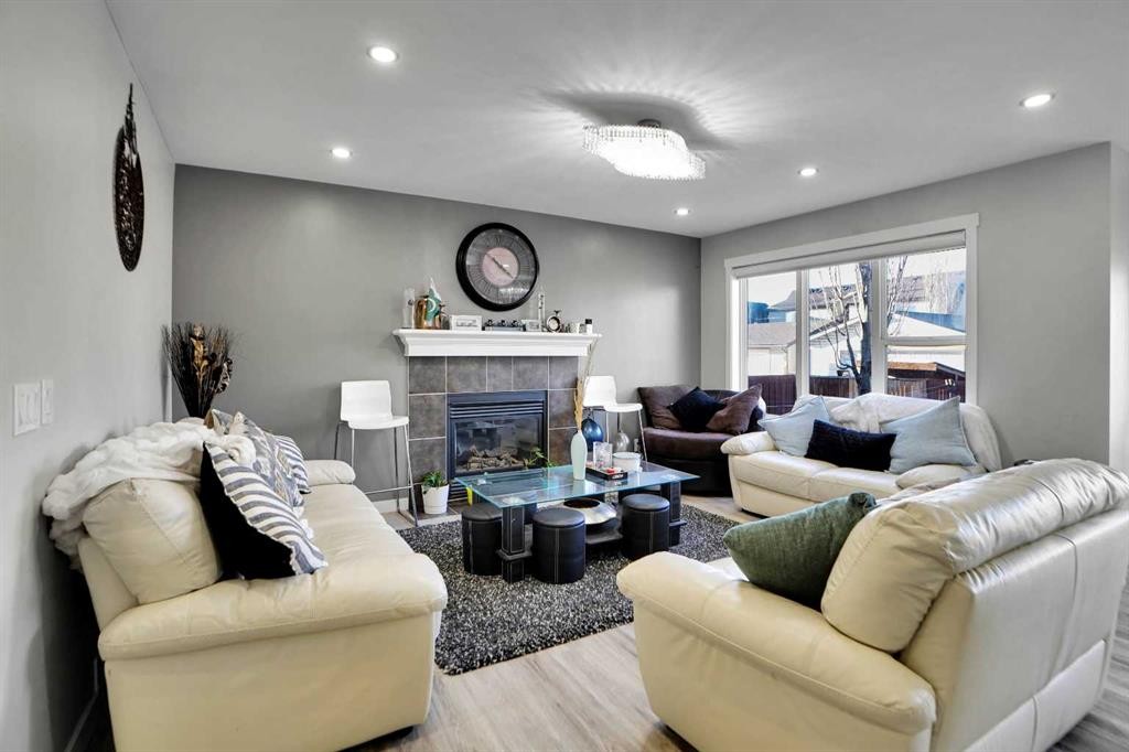 91 Copperstone Gate Se, Calgary, AB - Indoor Photo Showing Living Room With Fireplace