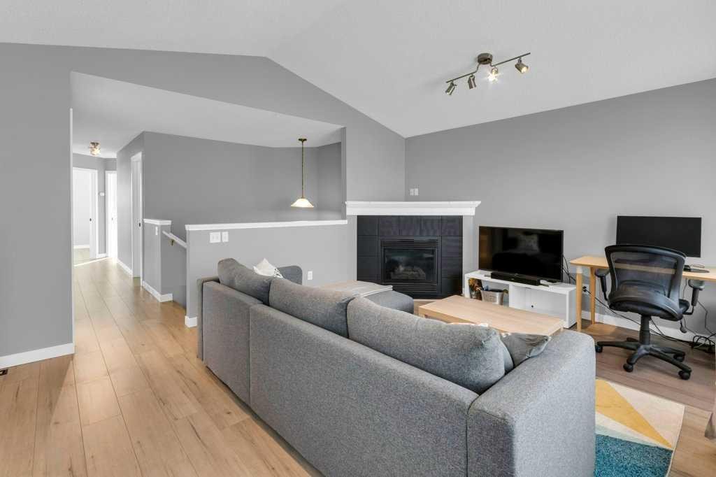 11185 Hidden Valley Drive Nw, Calgary, AB - Indoor Photo Showing Living Room With Fireplace