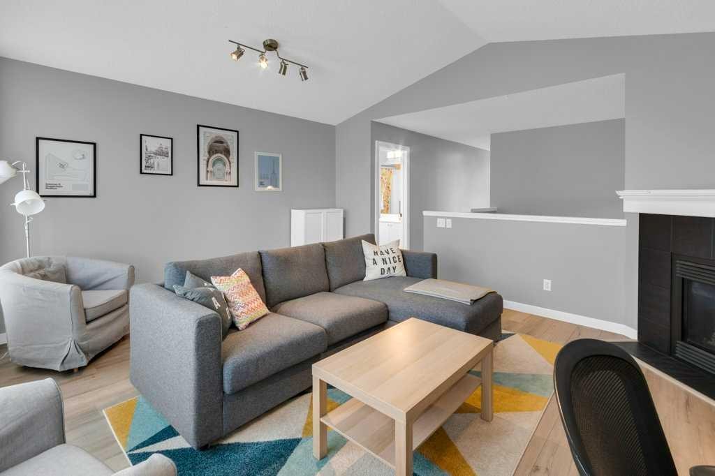 11185 Hidden Valley Drive Nw, Calgary, AB - Indoor Photo Showing Living Room With Fireplace