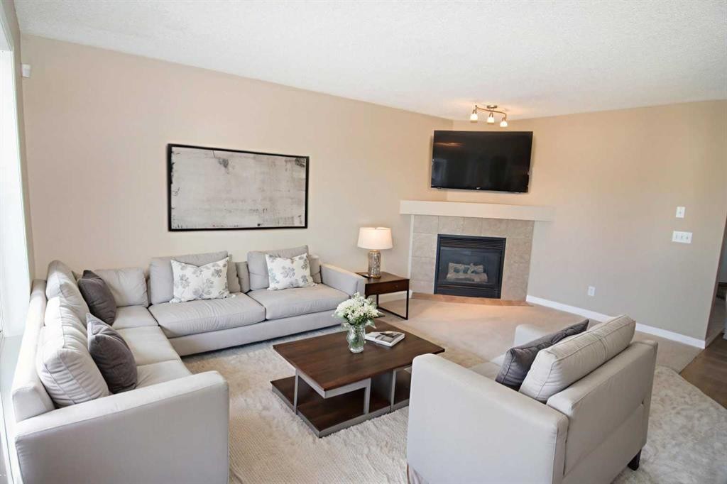 24 Panamount Lane Nw, Calgary, AB - Indoor Photo Showing Living Room With Fireplace