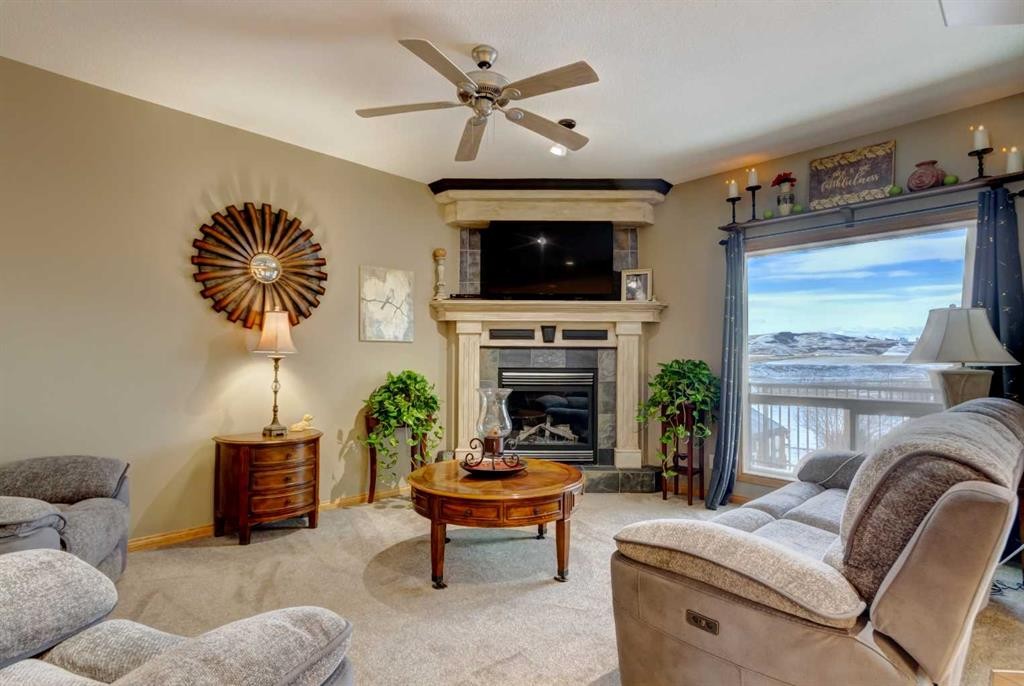 533 Highwood Drive, Longview, AB - Indoor Photo Showing Living Room With Fireplace