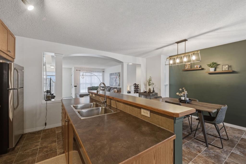 59 Prestwick Bay Se, Calgary, AB - Indoor Photo Showing Kitchen With Double Sink