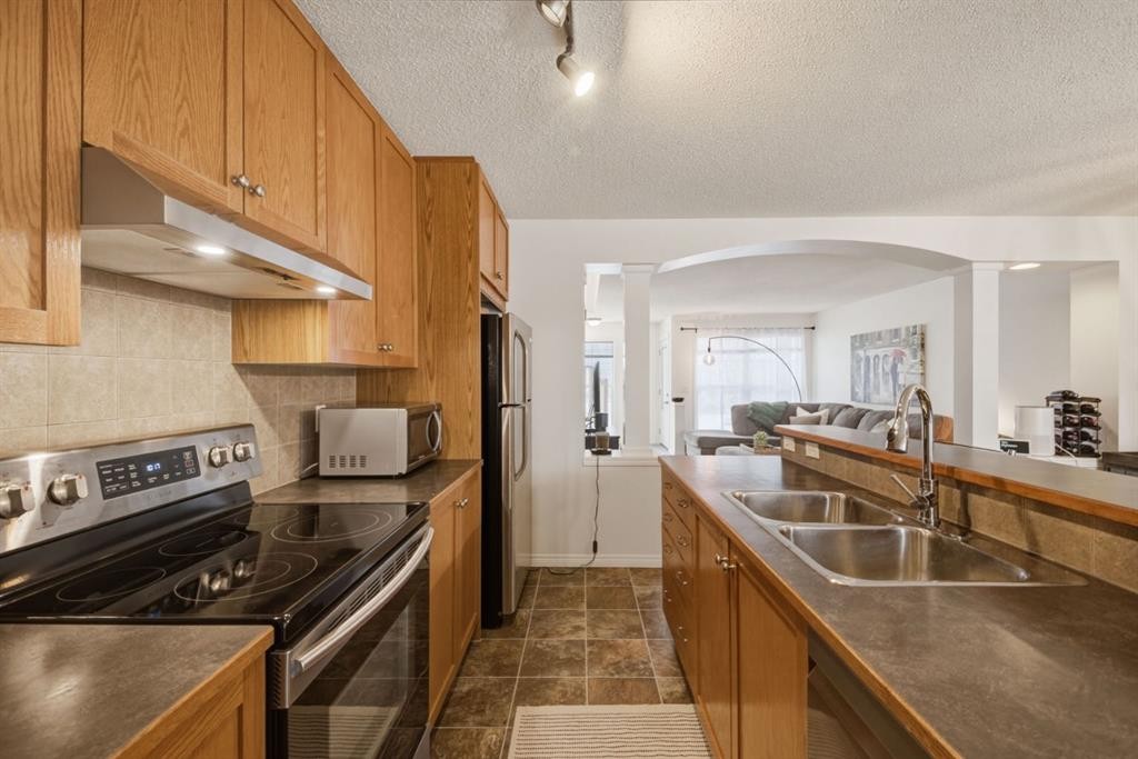 59 Prestwick Bay Se, Calgary, AB - Indoor Photo Showing Kitchen With Double Sink