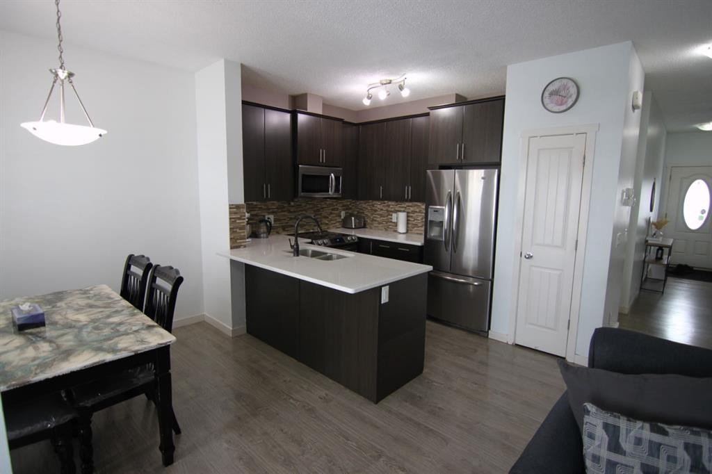 337 Copperpond Landing Se, Calgary, AB - Indoor Photo Showing Kitchen With Stainless Steel Kitchen With Double Sink