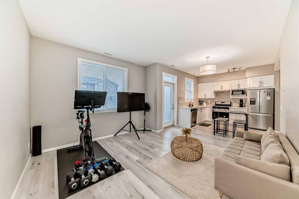 202-245 Redstone Walk Ne, Calgary, AB - Indoor Photo Showing Living Room