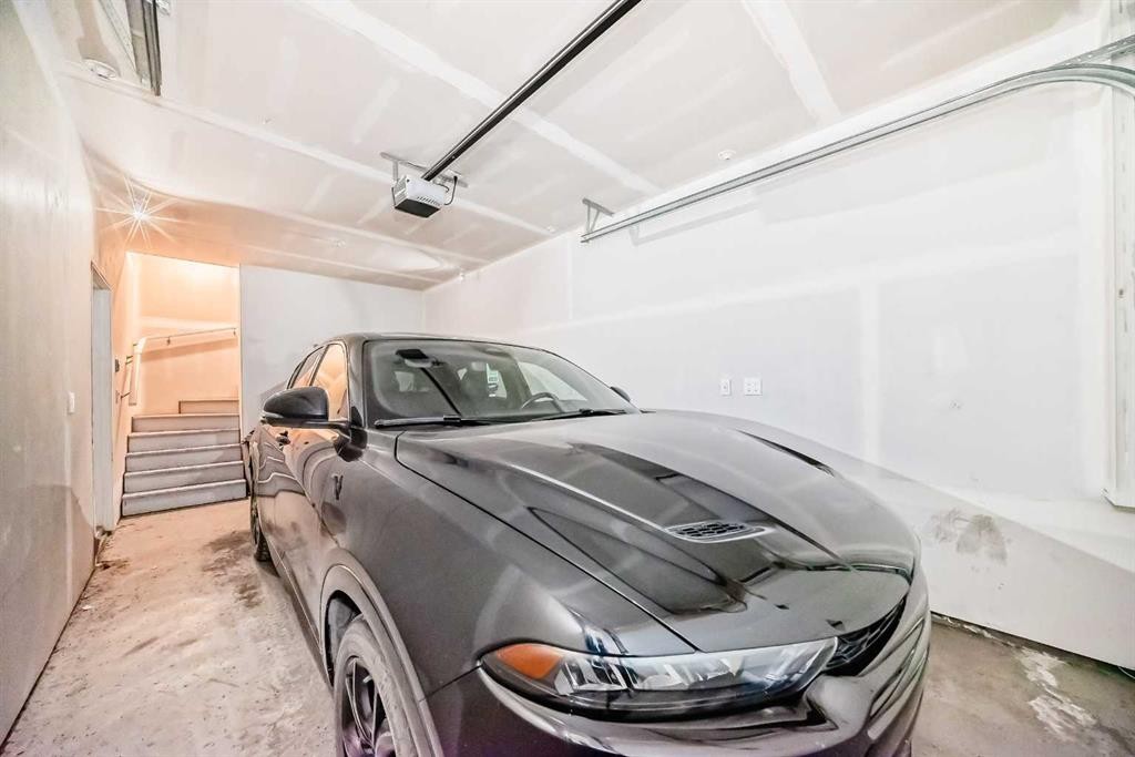 202-245 Redstone Walk Ne, Calgary, AB - Indoor Photo Showing Garage