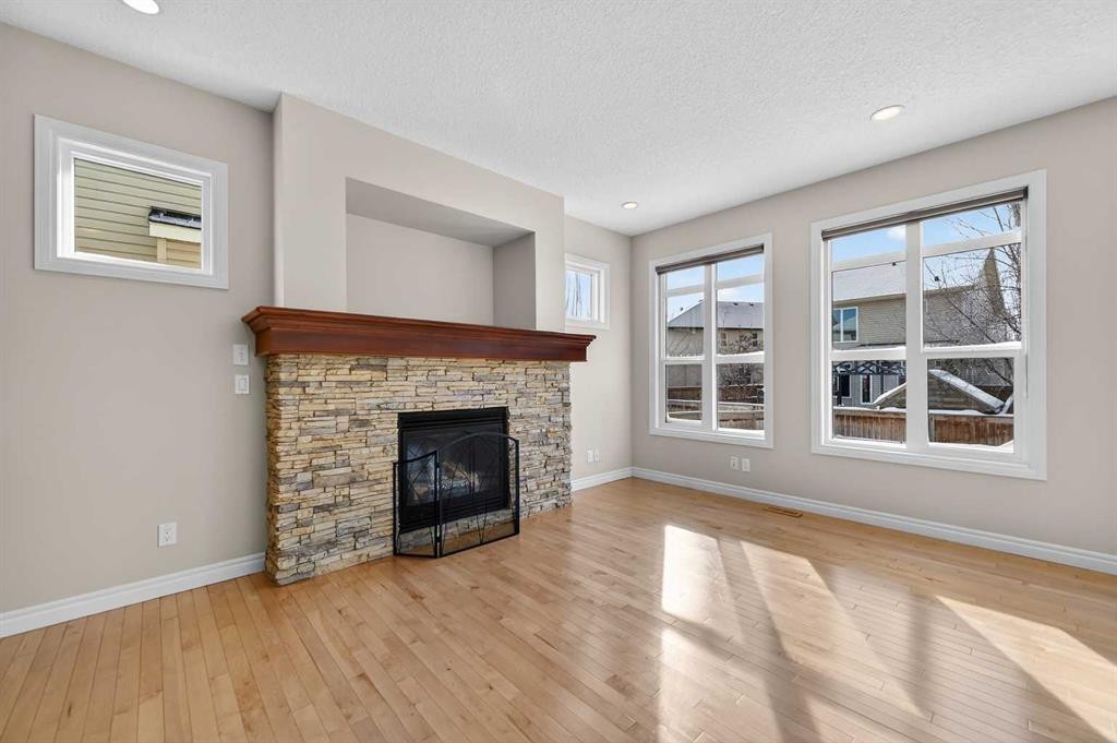 182 Cranarch Place Se, Calgary, AB - Indoor Photo Showing Living Room With Fireplace