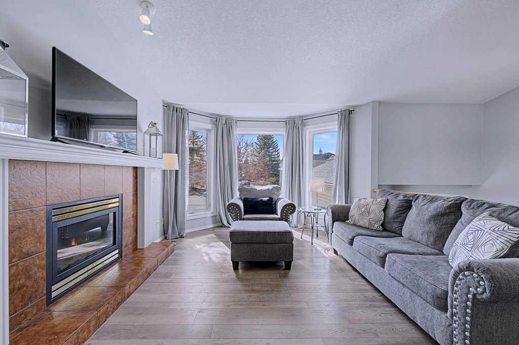 24 Sunlake Circle Se, Calgary, AB - Indoor Photo Showing Living Room With Fireplace