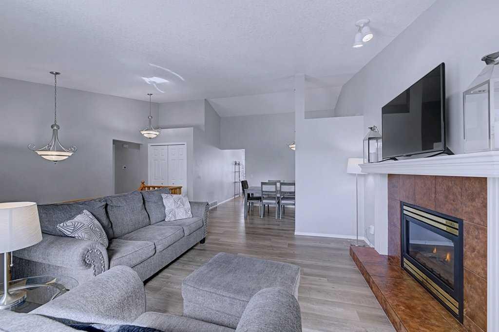 24 Sunlake Circle Se, Calgary, AB - Indoor Photo Showing Living Room With Fireplace