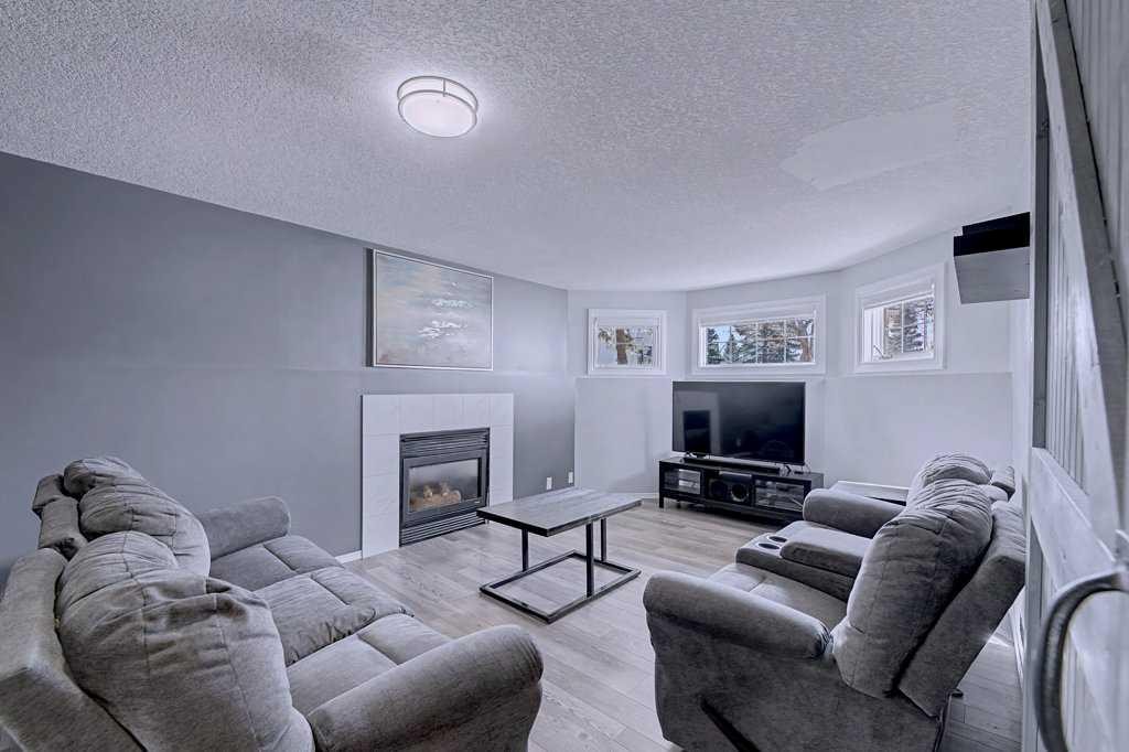 24 Sunlake Circle Se, Calgary, AB - Indoor Photo Showing Living Room With Fireplace