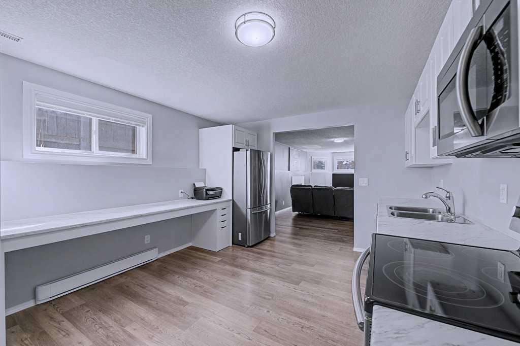 24 Sunlake Circle Se, Calgary, AB - Indoor Photo Showing Kitchen With Double Sink