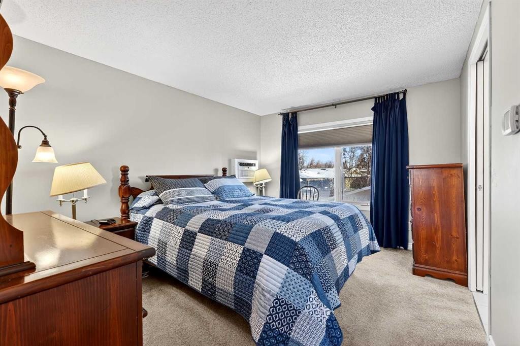 168 Midlake Boulevard Se, Calgary, AB - Indoor Photo Showing Bedroom