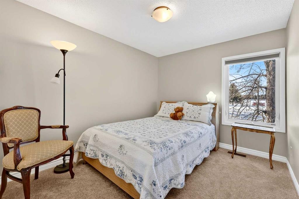 168 Midlake Boulevard Se, Calgary, AB - Indoor Photo Showing Bedroom