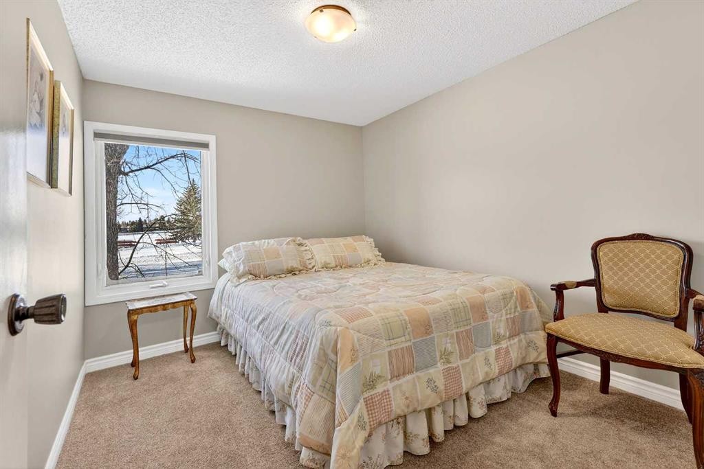 168 Midlake Boulevard Se, Calgary, AB - Indoor Photo Showing Bedroom