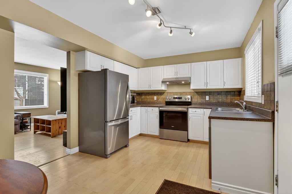 353 Regal Park Ne, Calgary, AB - Indoor Photo Showing Kitchen With Stainless Steel Kitchen