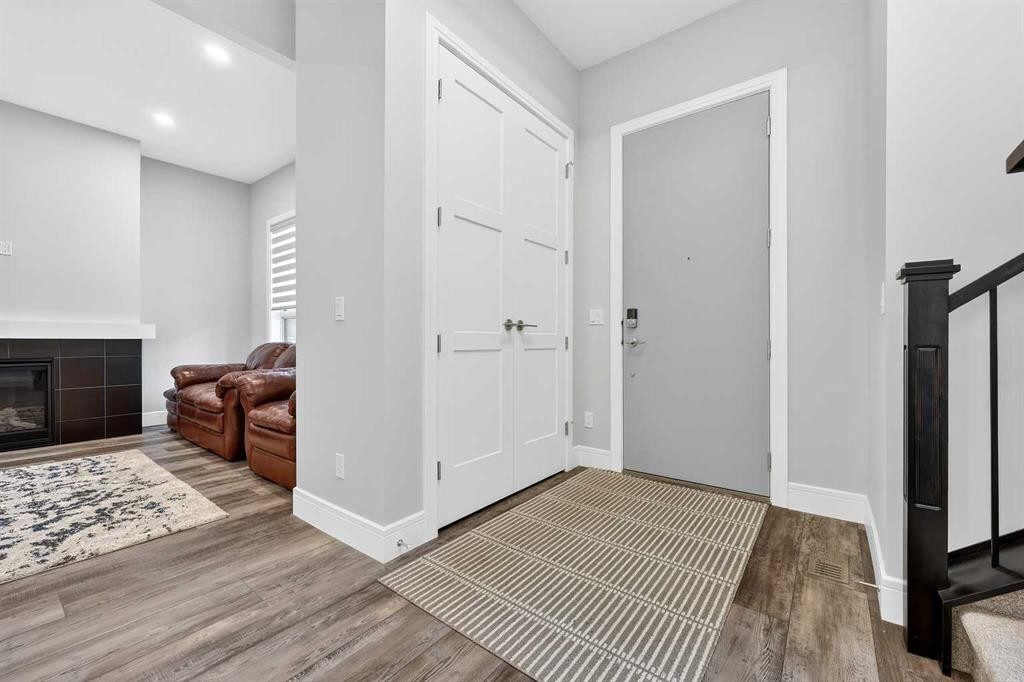 95 Rock Lake View Nw, Calgary, AB - Indoor Photo Showing Other Room With Fireplace