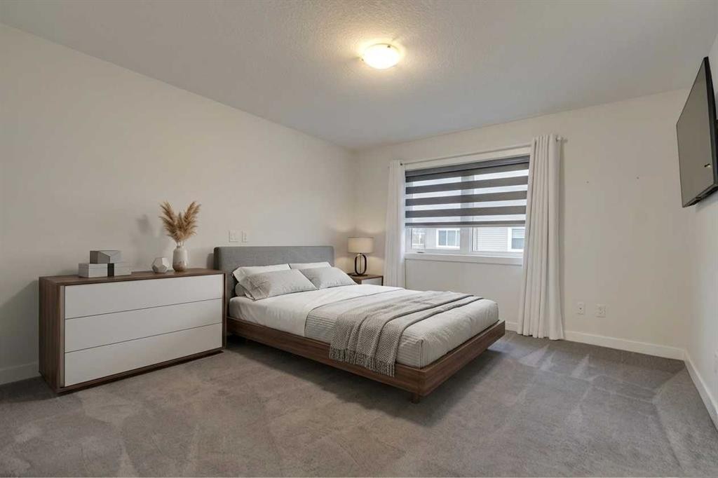 #208 Dawson Harbour Heights, Chestermere, AB - Indoor Photo Showing Bedroom