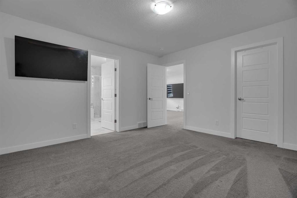 #208 Dawson Harbour Heights, Chestermere, AB - Indoor Photo Showing Other Room