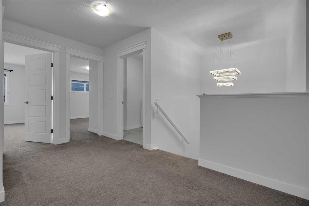 #208 Dawson Harbour Heights, Chestermere, AB - Indoor Photo Showing Other Room