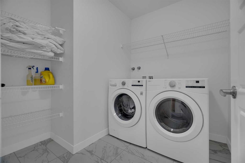 #208 Dawson Harbour Heights, Chestermere, AB - Indoor Photo Showing Laundry Room
